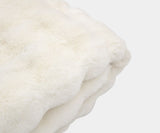 Create a serene sanctuary in your bedroom with the Serene Cream Faux Fur Throw Blanket. This incredibly soft, faux fur throw is perfect for adding a touch of cosy luxury.