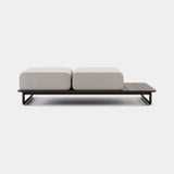 Domkapa Copacabana Outdoor Pouf, toffee outdoor fabric on a deck platform with Black Texturized legs