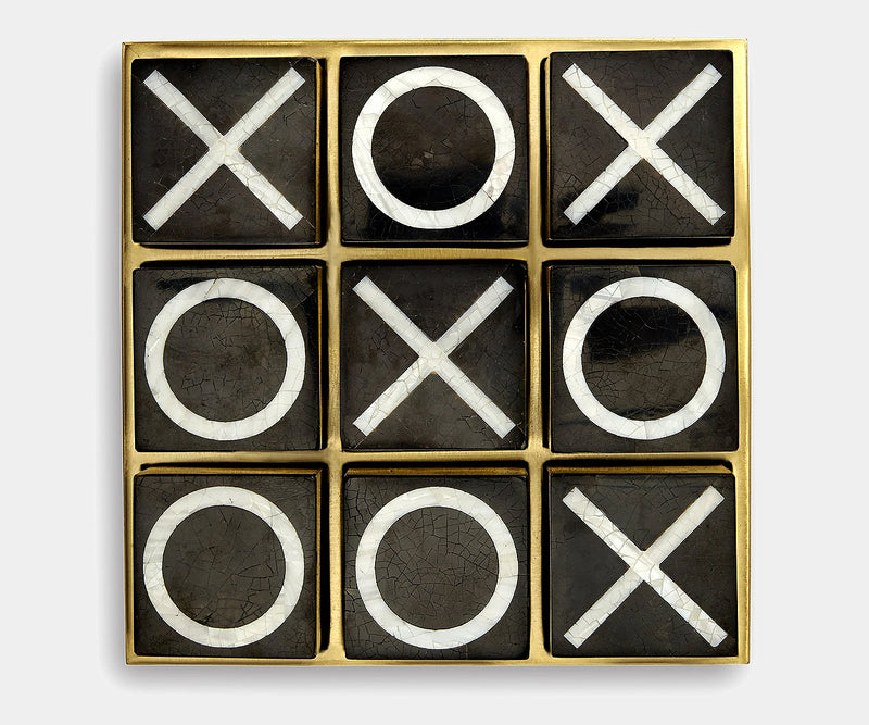 Luxury shell and brass tic-tac-toe game set by L'Objet, blending timeless design with modern elegance.