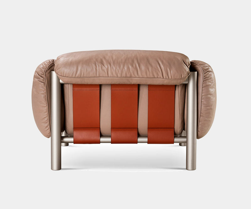 Elegant Flo Armchair by Ghidini 1961 with luxurious goose down upholstery and a sturdy metal frame.