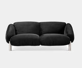 Ghidini 1961 Flo Sofa in luxurious black velvet, showcasing mid-century modern design for upscale interiors.