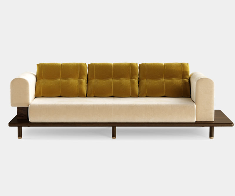 Modern Asymmetrical Sofa: Soft Fabric & Matte Wood Frame.  The Grant sofa by Mezzo Collection redefines modern comfort. This image highlights the key design elements: a captivating asymmetrical silhouette, soft and inviting fabric upholstery available in a variety of colors, and a contrasting yet beautiful matte wood frame.