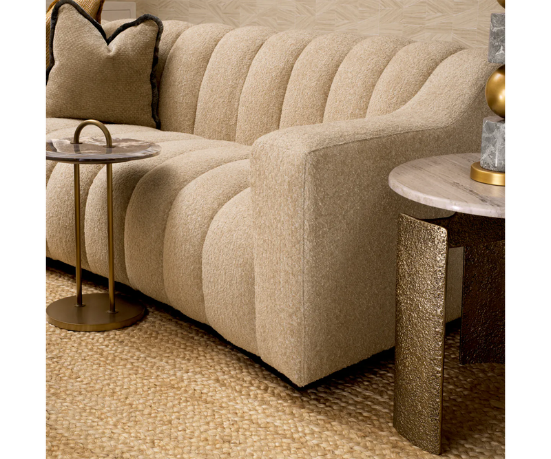 Unwind in unparalleled comfort with the Eichholtz Nuvola Sofa. Modern design and a soft cascade sand finish.