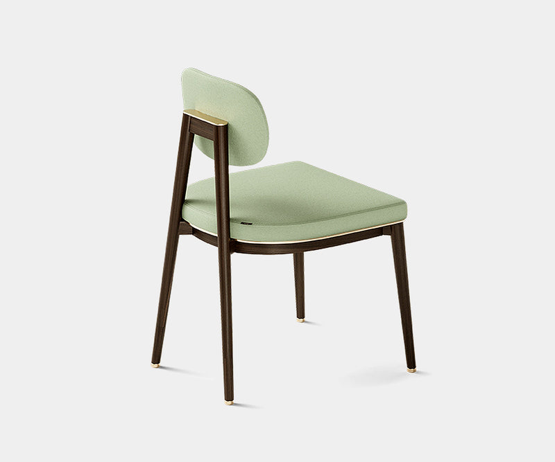 High-end Oscar dining chair with sleek minimalist style and brass accents.