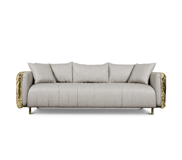 The Imperfectio Sofa by Boca Do Lobo: A celebration of Wabi-Sabi aesthetics. Hand-hammered brass and plush leather create a unique luxury piece.