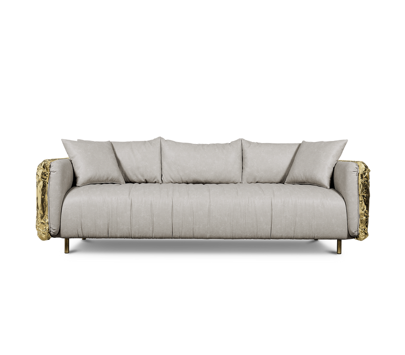 The Imperfectio Sofa by Boca Do Lobo: A celebration of Wabi-Sabi aesthetics. Hand-hammered brass and plush leather create a unique luxury piece.