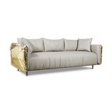 Embrace the beauty of imperfection with the Imperfectio Sofa. The hand-hammered brass base adds a touch of artisanal character.