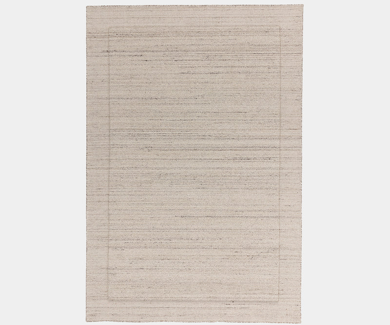 Larson Ivory luxury rug made from natural wool for modern, elegant interiors.