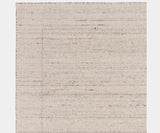 Handcrafted Larson Ivory rug enhancing a contemporary, high-end living room.