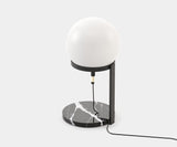 Elegant Clarke Table Lamp featuring a large glass globe and a polished marble base, ideal for modern home decor.