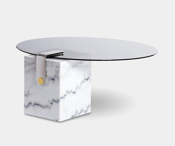 Luxurious white marble Patch coffee table with brass and stainless steel accents, featuring a polished glass top for modern high-end interiors.