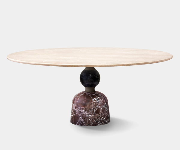 Luxury Artù dining table with a circular marble top and sculptural metal base for high-end home decor.