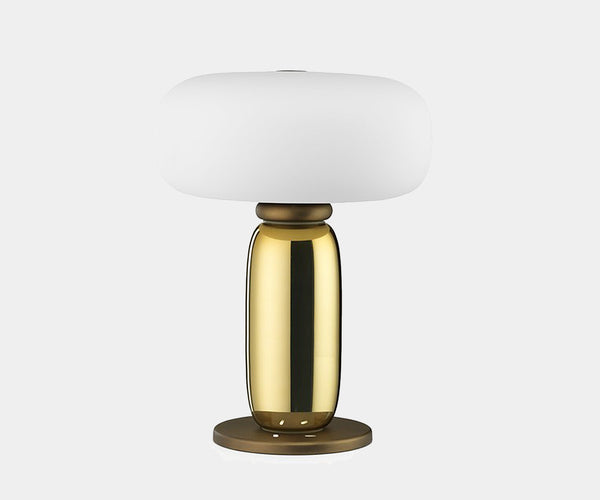 Elegant table lamp with a polished metal base and rounded frosted glass shade by Ghidini1961.