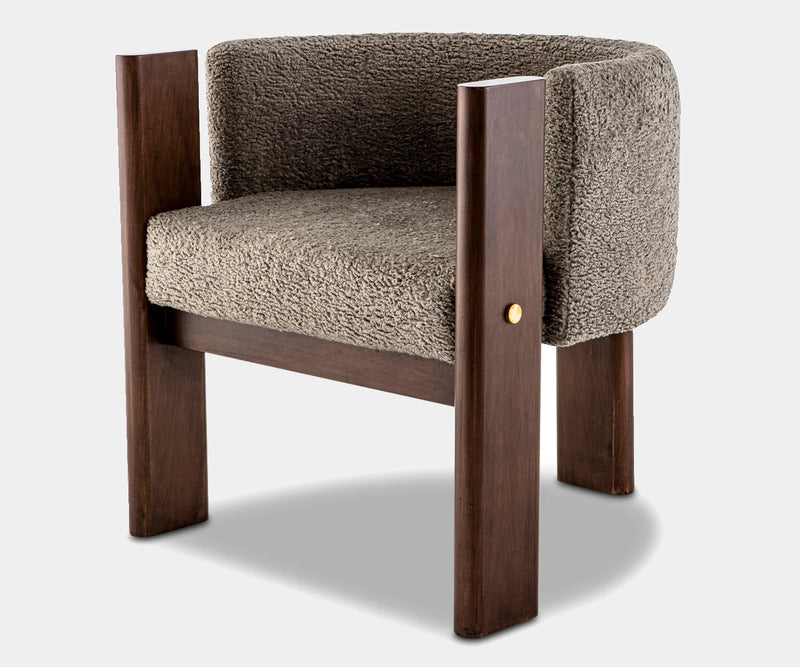 Luxury grey bouclé dining chair with solid walnut frame, designed for high-end modern interiors.