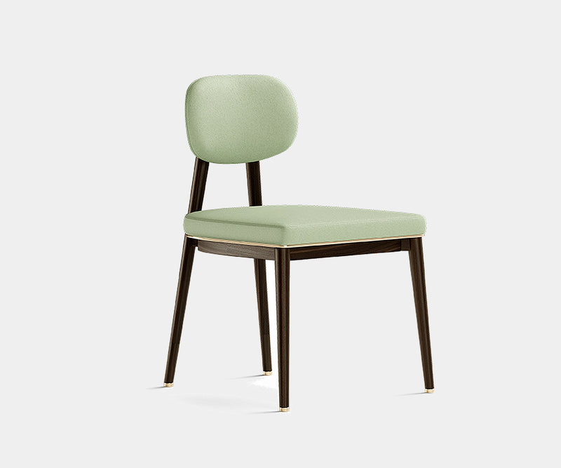 Oscar minimalist dining chair with eucalyptus wood frame and brass accents in a modern interior.