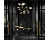 Luxury Newton Bathtub featuring gold-cast iron with high-gloss black lacquered spheres, designed by Maison Valentina.