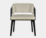 Modern dining chair featuring matte black oak frame and brown velvet seat from Luxxu