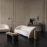Creme Travertine Console Table with Bronze Accents, styled in a living room