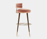 High-end Betsy Bar Chair with fabric upholstery and modern tapered lacquered legs, ideal for luxury interiors