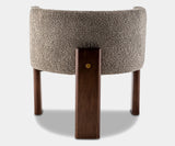 High-end dining chair with grey bouclé fabric and minimalist walnut frame, ideal for contemporary luxury spaces.