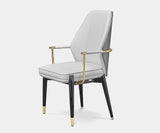 Luxxu Algerone II luxury dining chair with grey leather and polished brass accents