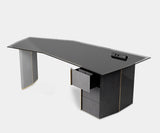 Algerone Desk in a luxury workspace with modern technology and refined design.