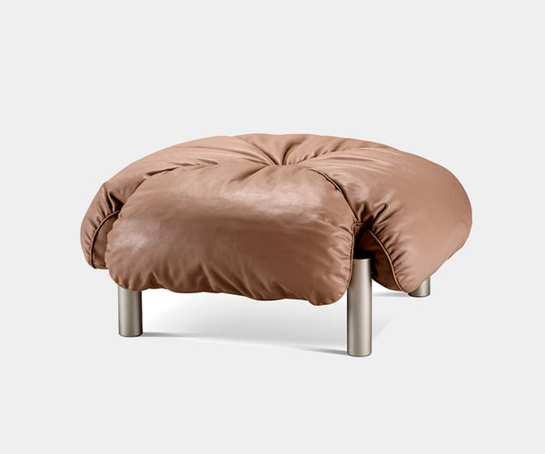 Elegant leather Flo Ottoman by Ghidini 1961 showcasing mid-century modern design.