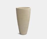 Elegant cream stripe vase enhancing a luxury home and garden design.