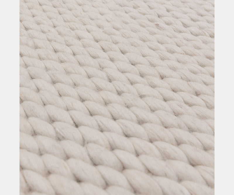 Close-up of the Zander Ivory rug texture, showcasing its chunky, elegant design.