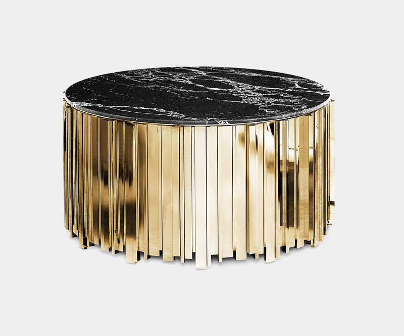 Nero Marquina marble and gold center table creates a luxurious focal point in a modern living room.