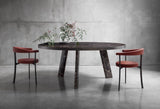 Nuraghe Round Splayed Leg Marble Luxury Dining Table in a room setting