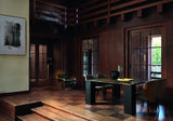 Ricci marble dining table on black ash legs in a classic wood panelled dining room