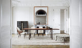 Rocco Metal Base Luxury Dining Table styled in a luxury interior