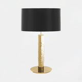 Castro Lighting Safi Shade Table Lamp in gold-plated brass with a black lampshade, available from Touched Interiors UK