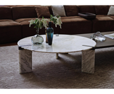 Close-up of the brass-plated aluminum base and marble top of the Ghidini 1961 Ottanta coffee table, highlighting its craftsmanship.