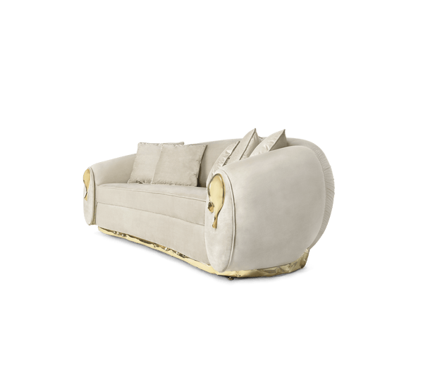 Soft curves and gleaming brass details define the Soleil Sofa. This statement piece by Boca Do Lobo is a conversation starter.