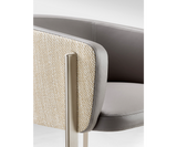 Versatile Ghidini 1961 Arch Chair complementing a chic dining area with contemporary design.