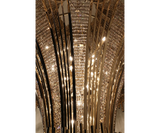 Statement Chandelier for Hospitality or Residential Lighting: The Scala Chandelier, a showstopping focal point with gold-plated brass and luminous teak crystals, ideal for hospitality projects and elegant homes.