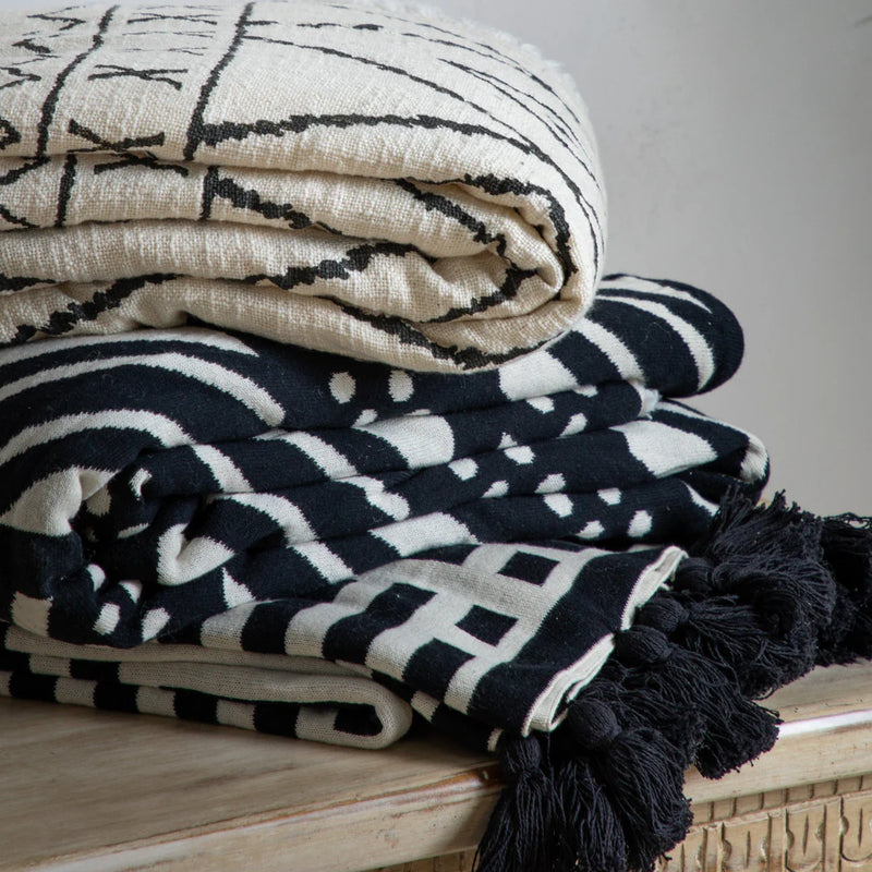 The Perfect Blend of Comfort and Style: Modern Knit Throw with Tassels. This beautifully crafted knit throw offers a delightful textural experience and comes in a variety of stylish colorways. Find the perfect match for your home!