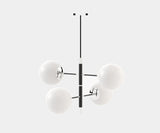 Modern glass globe chandelier from Laskasas, adding a touch of luxury to dining room lighting.