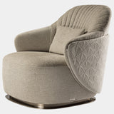 The Adele Armchair by Marco Piva: Unwind in unparalleled style. This luxurious armchair boasts quilted leather upholstery, a polished chrome base, and a dividing profile for a touch of modern elegance.
