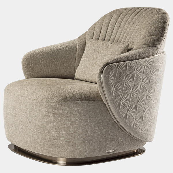 The Adele Armchair by Marco Piva: Unwind in unparalleled style. This luxurious armchair boasts quilted leather upholstery, a polished chrome base, and a dividing profile for a touch of modern elegance.