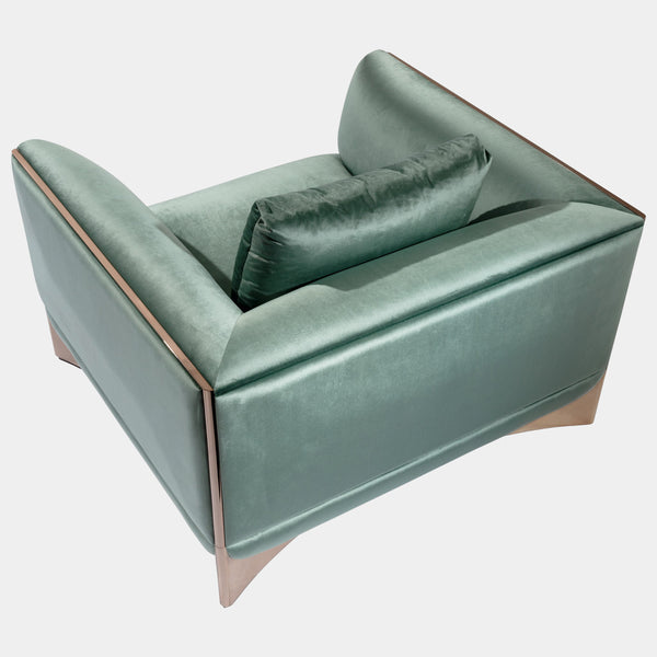 Luxury Modern Armchair: The Ca' Foscari Armchair by Visionnaire features a sleek, curved stainless steel base with a high-shine finish, contrasting beautifully with the soft upholstery. This modern statement piece is perfect for any high-end living space.