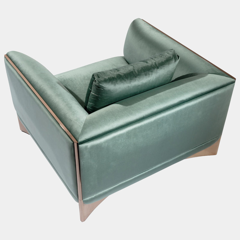 Luxury Modern Armchair: The Ca' Foscari Armchair by Visionnaire features a sleek, curved stainless steel base with a high-shine finish, contrasting beautifully with the soft upholstery. This modern statement piece is perfect for any high-end living space.