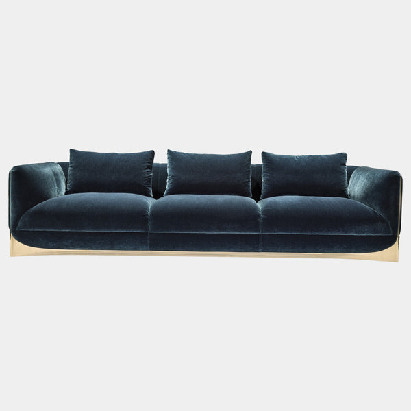 Visionnaire's Ca' Foscari Sofa: Award-Winning Design & Unparalleled Comfort. This modern sofa, designed by Alessandro La Spada (winner of the Archiproducts Design Awards 2022 for Sustainability), features a contrasting interplay of a curved stainless steel base and soft velvet upholstery (other upholstery options available). Memory Foam® comfort and loose feather cushions create a luxurious haven for relaxation.