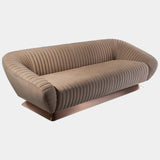 Unwind in Sophisticated Comfort: The Citizen Sofa by Mauro Lipparini. This luxurious sofa boasts an all-over canneté quilted motif, plush Memory Foam® seating, a customisable base, and is available in a one-armrest version for added versatility.