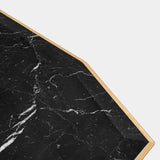 Dynamic Console Table for Conversation: The Scarp Console, a dynamic console table with a rebellious design featuring polished brass legs and Nero Marquina marble, is guaranteed to spark conversation and become a treasured piece in your home.