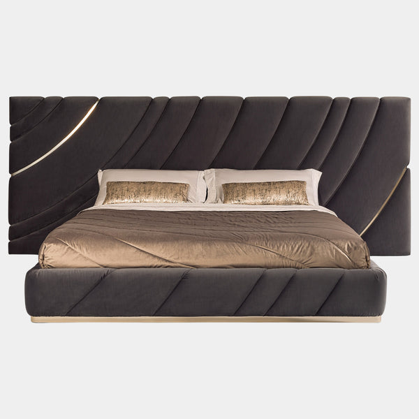 Visionnaire Ultrasound Bed: Modern luxury bed featuring a wave-design headboard with stainless steel details and a plush, upholstered frame.