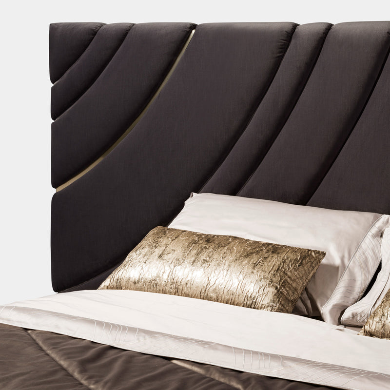 Luxury Italian Bed Frame: The Ultrasound Bed by Visionnaire offers a stunning centerpiece for your bedroom with its wave-pattern headboard and sleek stainless steel accents.